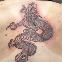 Explore our linework dragon tattoo by Tiny, featuring intricate designs and mythical inspiration at The Wolves Den. Linework dragon tattoo by Tiny at The Wolves Den Pakenham.