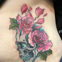 Explore our neo-traditional skull tattoo by Tiny, blending bold colors with traditional themes at The Wolves Den. Neo-traditional skull tattoo by Tiny at The Wolves Den Pakenham.